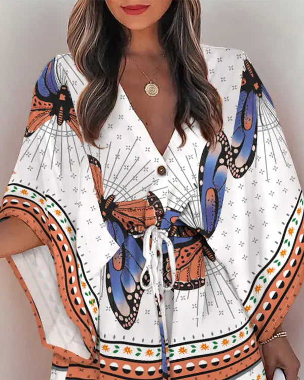 Naia - Afslappet minikjole med sommerfugletryk