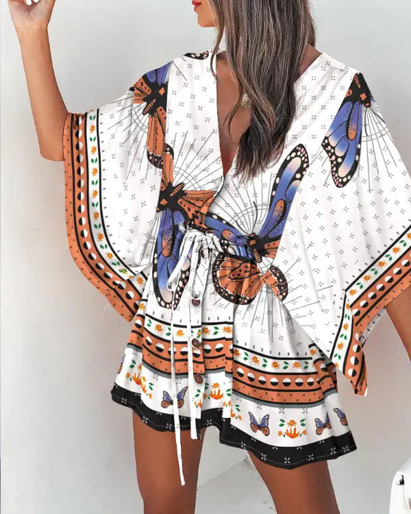 Naia - Afslappet minikjole med sommerfugletryk